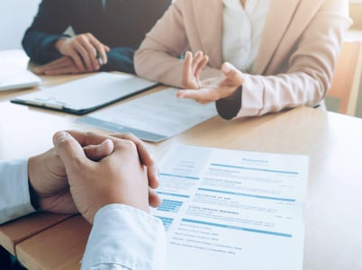 A job interview, focused on the interviewee's hands